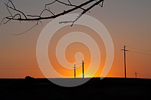 Orange sunset and electric pylons