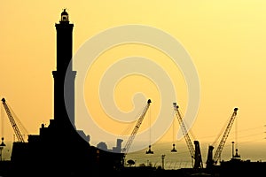 Orange sunset at Lanterna, the old lighthouse. Genova. Liguria, Italy photo