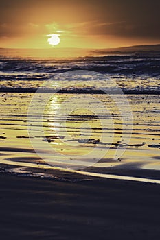 Orange sunset over Enniscrone Beach, Ireland.