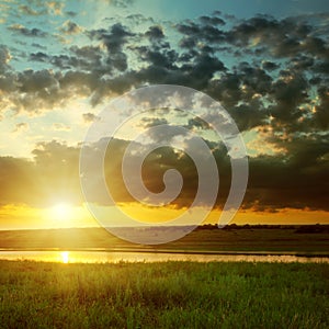 Orange sunset over river