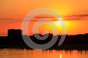 Orange sunset over river Dnieper in Kremenchug city, Ukraine