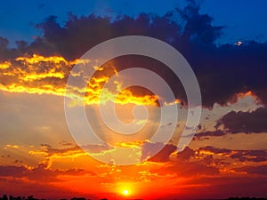 Orange sunset sky with clouds