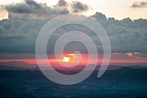 Orange sunset under big cloud