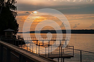 Orange sunset on the Volga river. the sun in the clouds