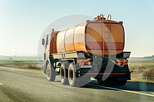 Orange Tank Truck on road