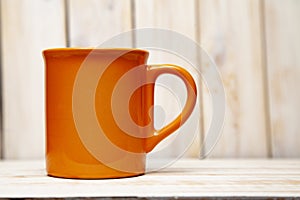 Orange tea cup on a white background retro boards