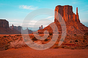 Orange and teal sunset view at Monument Valley, Arizona, USA