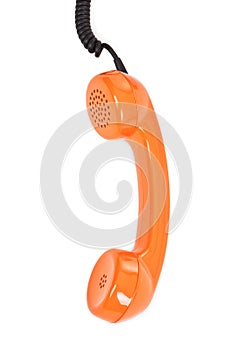 Orange telephone receiver over white