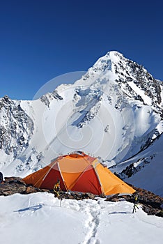 Orange tent in mountains