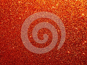Orange textured background with glitter effect background.