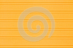 Orange textured cardstock paper closeup background