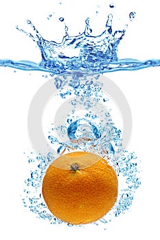 Orange thrown into water photo