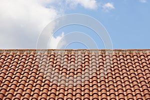 Orange tile roof over a blue sky