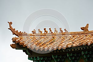 Orange tiled traditional rooftop in China, closeup view