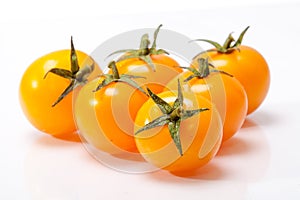 Orange tomato isolated on white background