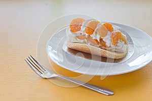 Orange topped on pancakes in coffee shop