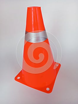 Orange traffic cone isolated on a white background