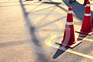 Orange traffic cones in outdoor parking lot