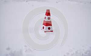 Orange traffic cones sits on the snow road falls, Do not park on the sidelines