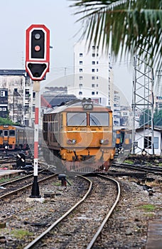 Orange Train locomotive approaching to Bangkok Rai