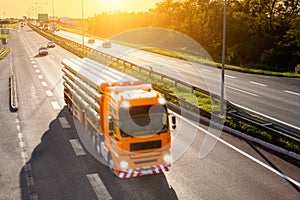 Orange truck in motion blur on the highway