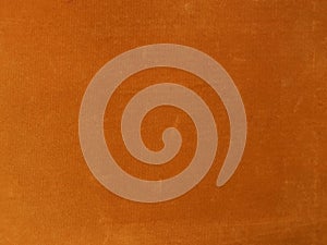 Orange velvet fabric texture used as background. Empty orange fabric background of soft and smooth textile material. There is