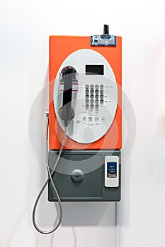 Orange vintage public pay phone