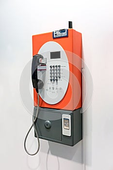 Orange vintage public pay phone