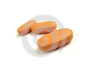 Orange vitamin pills