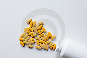Orange vitamin pills background