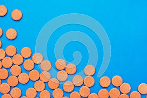 Orange vitamin pills