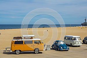 orange VW combi camper wagens and beetle at Aircooled classic car show