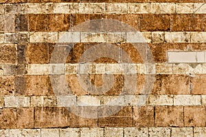 Orange wall bricks worn background. Horizontal stripes