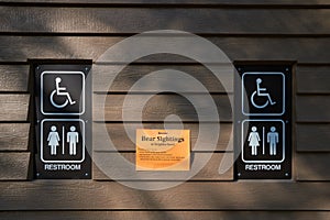 Orange warning sign on the restroom at Moose Creek Campground: Recent Bear Sightings in Neigborhood