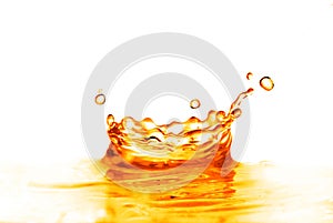 Orange water splash isolated on white