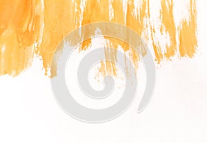 Orange watercolor brush strokes on white paper. Horizontal background with stains of watercolour paint.