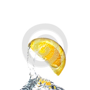Orange wedge splash in water