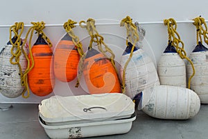Orange and white boat bumpers