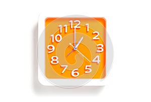 Orange White/Orange clock pointing at 1AM or 1PM