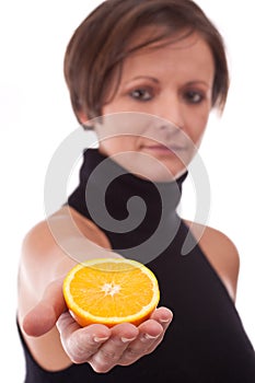 Orange in woman hands