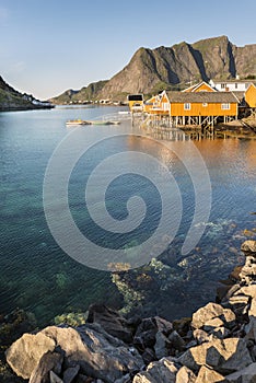 Orange wooden house called rorbu