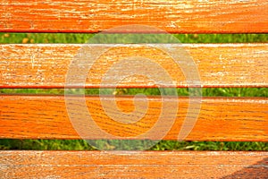 Orange wooden texture and green grass background