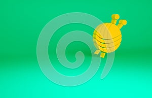 Orange Yarn ball with knitting needles icon isolated on green background. Label for hand made, knitting or tailor shop