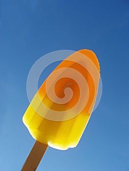 Orange and yellow ice lolly photo