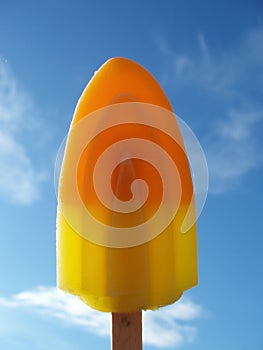 Orange and yellow ice lolly photo