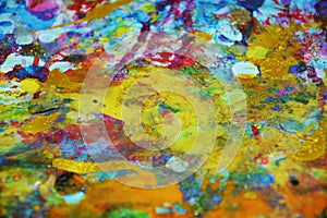 Orange yellow purple blue gold paint blurred splashes, colorful vivid waxy colors, contrasts creative background