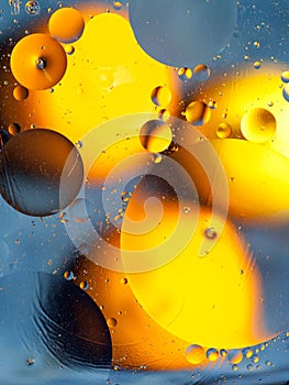 Orange and yellow spots on a blue background macro space2