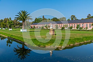 Orangerie and surrounding garden at Schwetzingen palace in Germany during sunny summer day