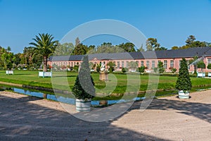 Orangerie and surrounding garden at Schwetzingen palace in Germany during sunny summer day