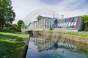 Orangery of Palmse manor and reflection in water canal